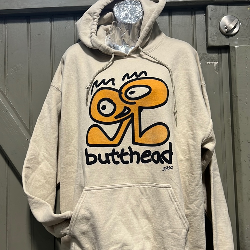 Vintage design on new hoodie. Sand color hood printed with water based ink.